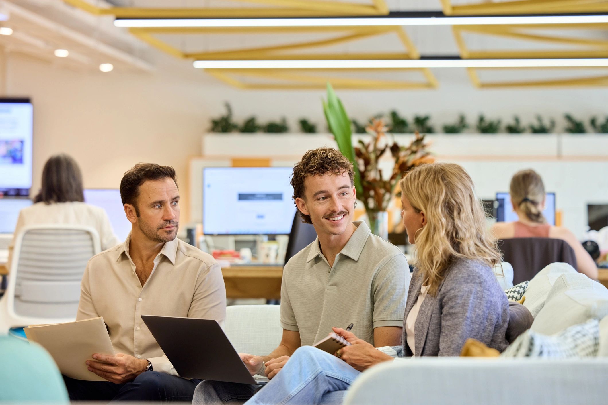 Australian IT team collaborating in a modern office